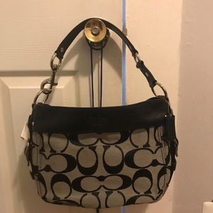 Coach purse , NEVER used , tag still attached .
